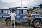 1975 Bangladesh. Driver, interpreter beside vehicle